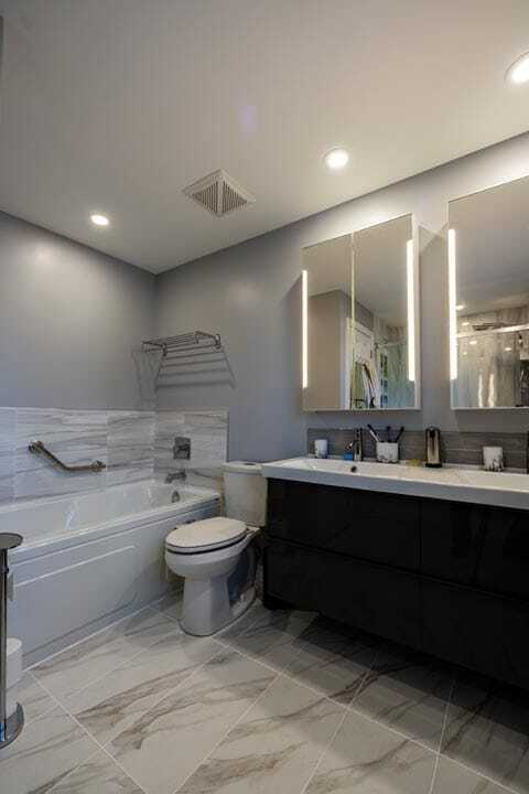 heated tiled floor with wall mount bathroom reno