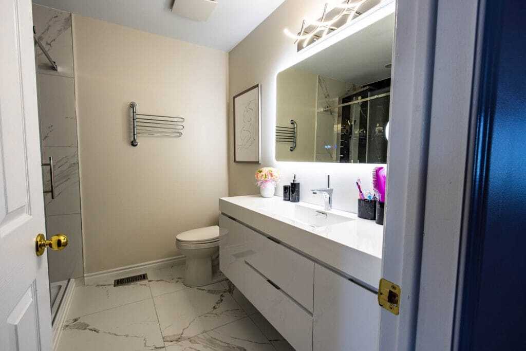 painted bathroom wall with tiles shower wall and floating vanity reno