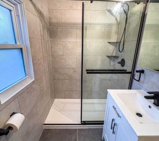 shower with tiled walls and small vanity modern bathrooms
