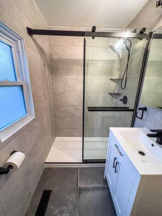 shower with tiled walls and small vanity modern bathrooms