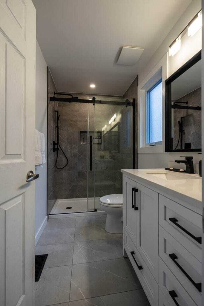 large tile floor with tiled shower and vanity renovation