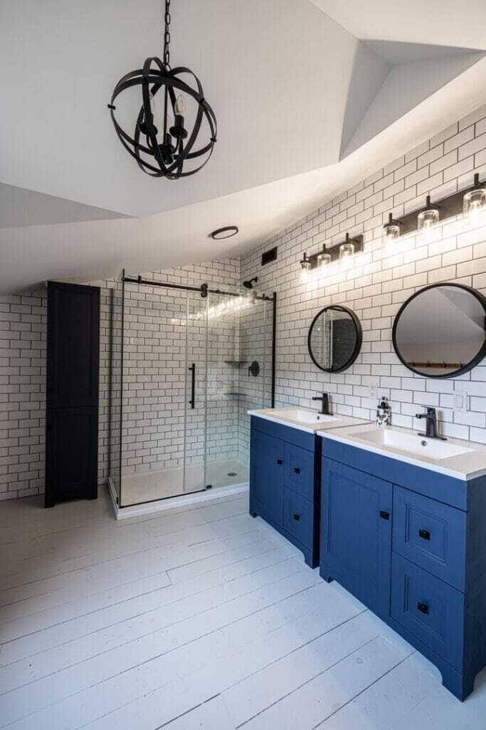 Acrylic shower base with subway tiles