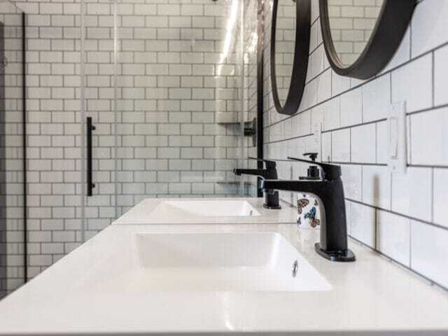 subway wall tiles with blue vanities