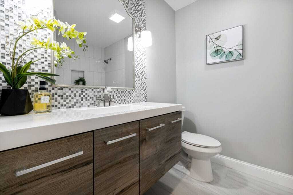 poreclain bathroom counter top with toilet and attached vanity