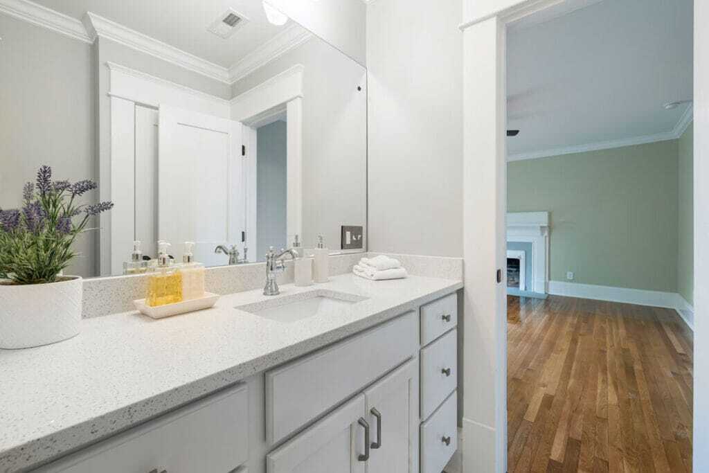 concrete bathroom countertop with attached vanity with vinyl flooring