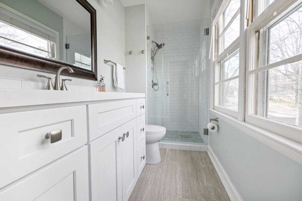 subway tiles walls with white vanity and counter top