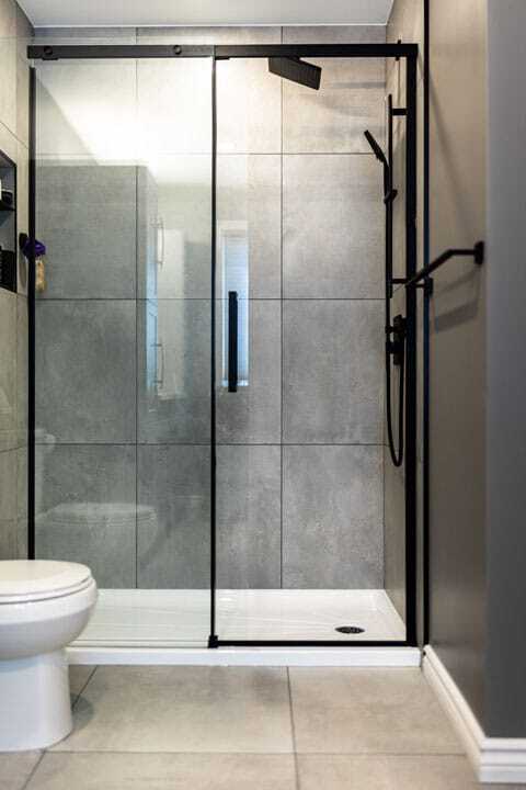 Tub to shower conversion in a condo bathroom