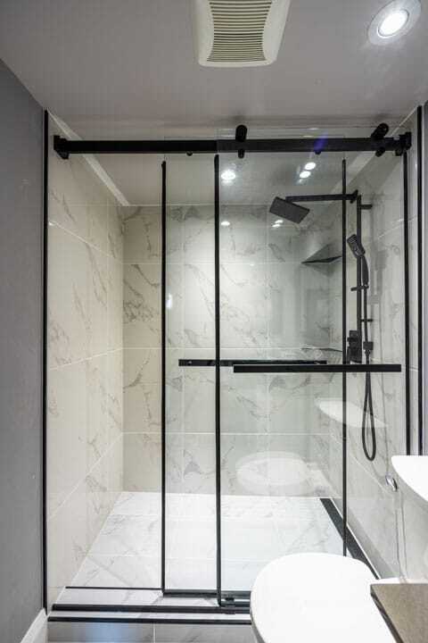 tub to shower conversion with white base marble tiles
