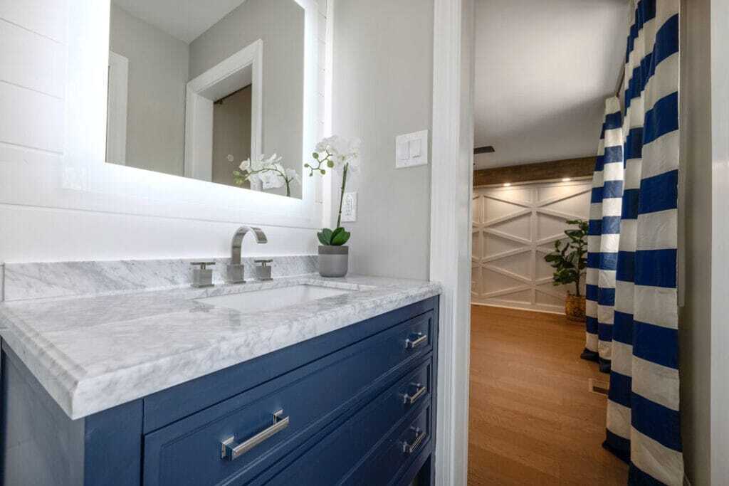 Blue vanity with marble counter top