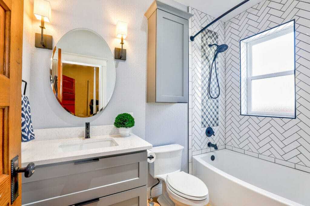 tiled wall with attached bath tub bathroom renovation