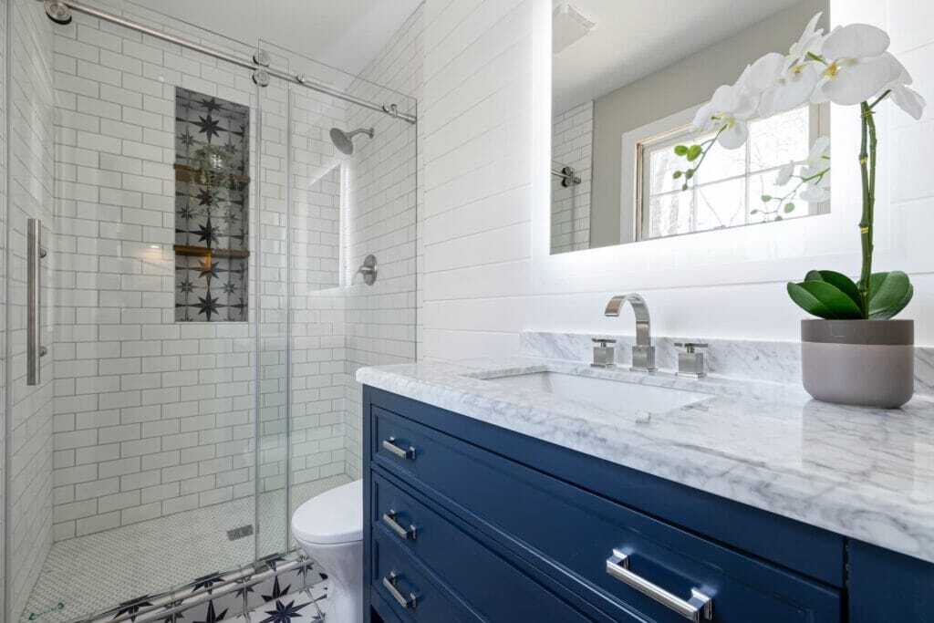 blue vanity and subway tiled wall renovation