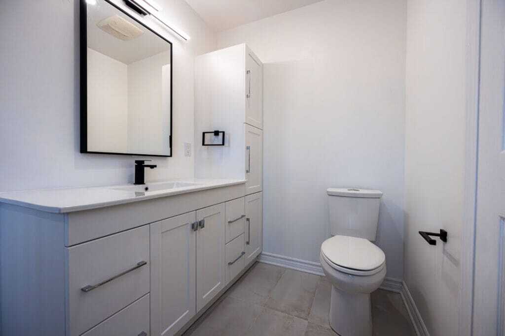 custom bathroom vanity and large square mirror
