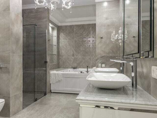 Luxury grey large tiled bathroom with matching vanity