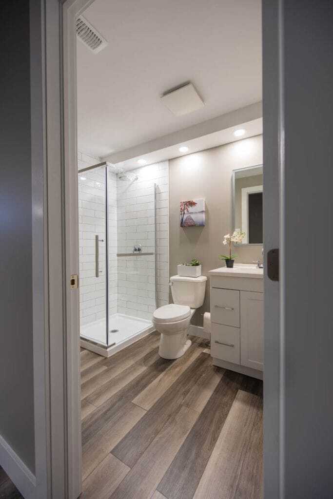 subway tile shower with vinyl flooring