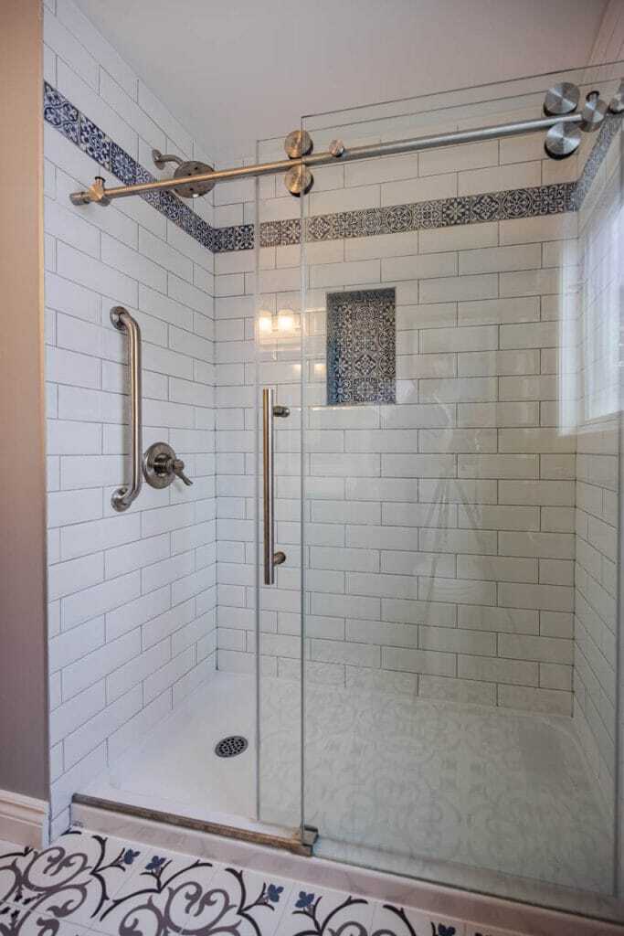 subway tiled shower walls with vintage border