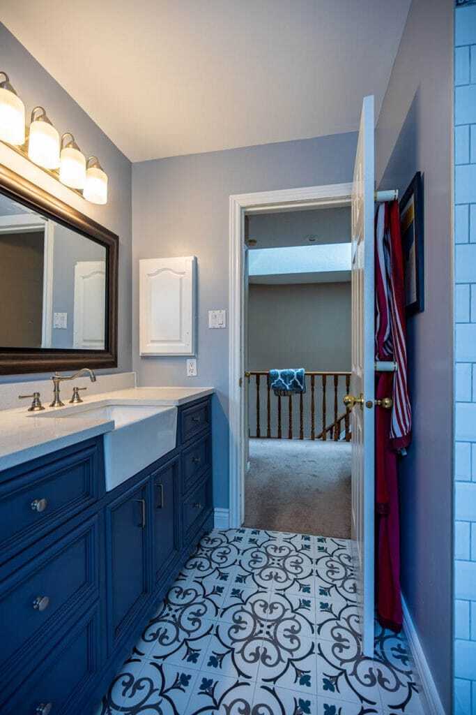 modern design with blue vanity and subway tiles