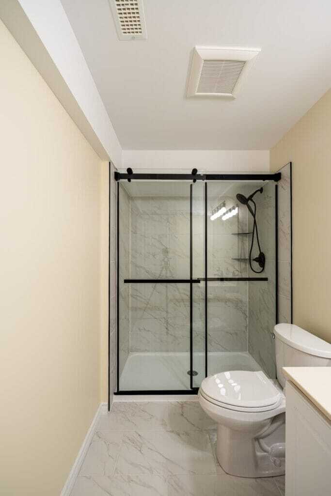 basement bathroom renovation with tiled walls