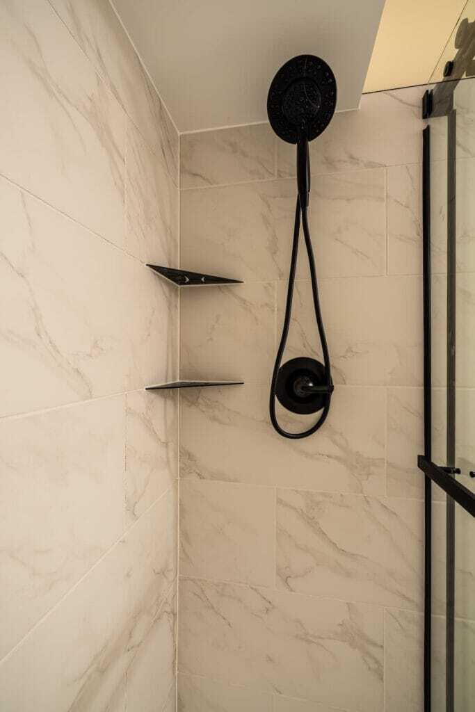 acrylic base with tiled walls Schluter corner niches