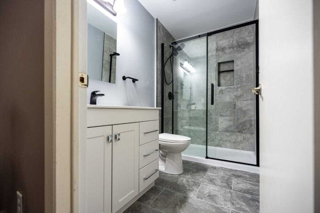 installed vanity, toilet with electrical fixtures