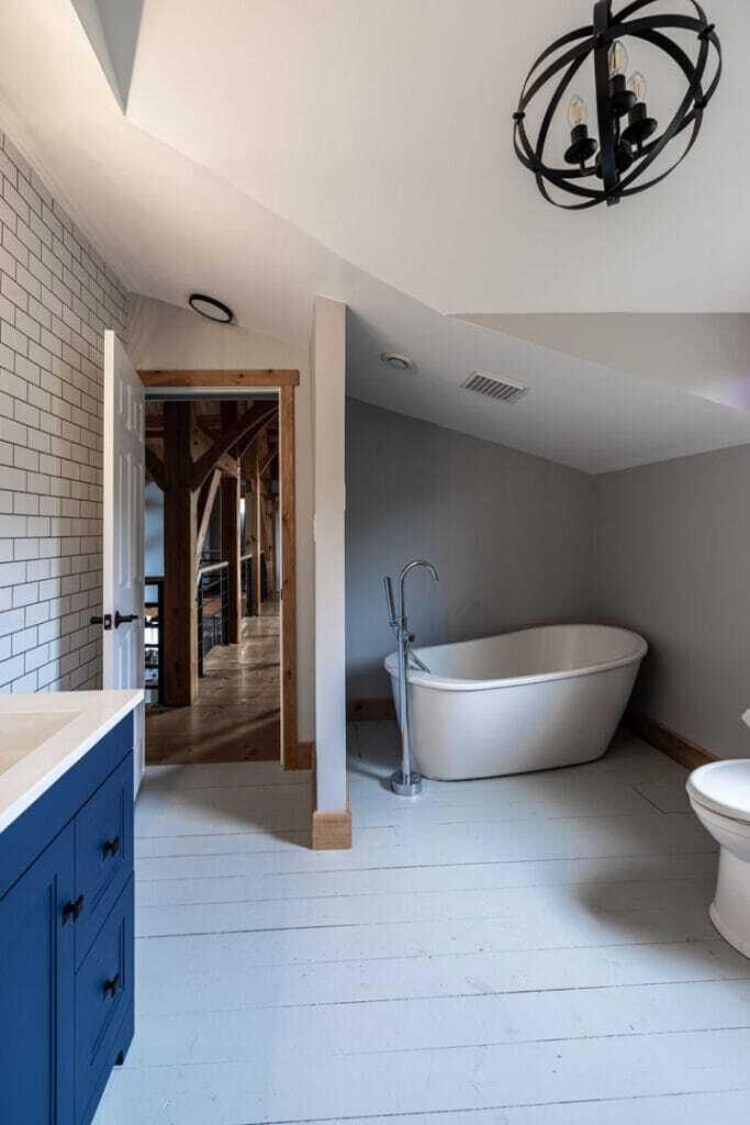 vintage bathroom renovation with tub subway tiles