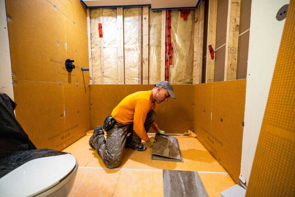 ibathroom team installing heated flooring