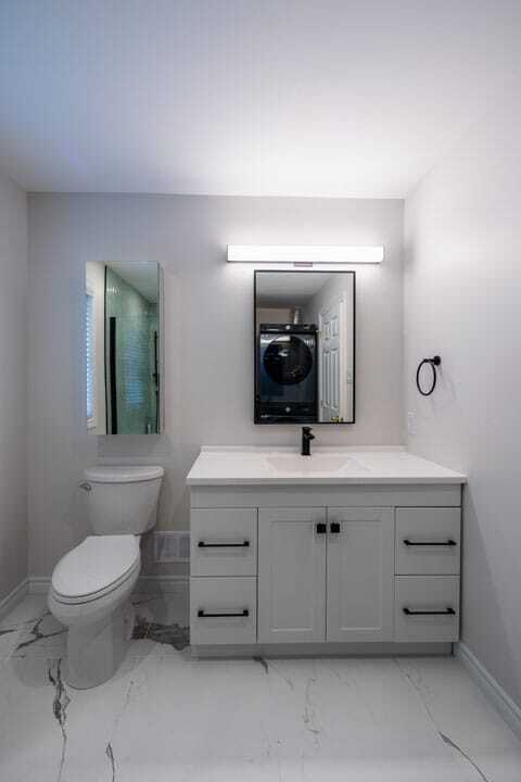 white vanity white marble tiles