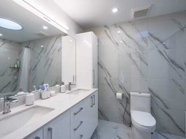 Renovated white stone bathroom